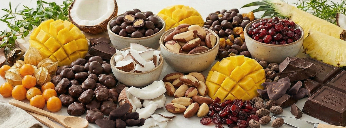 Holiday dessert board with Green Sun dark chocolate covered fruit and nuts, fresh mango, pineapple and clementines