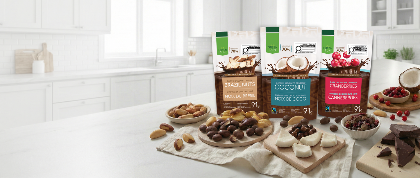 Green Sun organic dark chocolate snacks featuring brazil nuts, coconut and cranberries made with 70% Peruvian cacao.