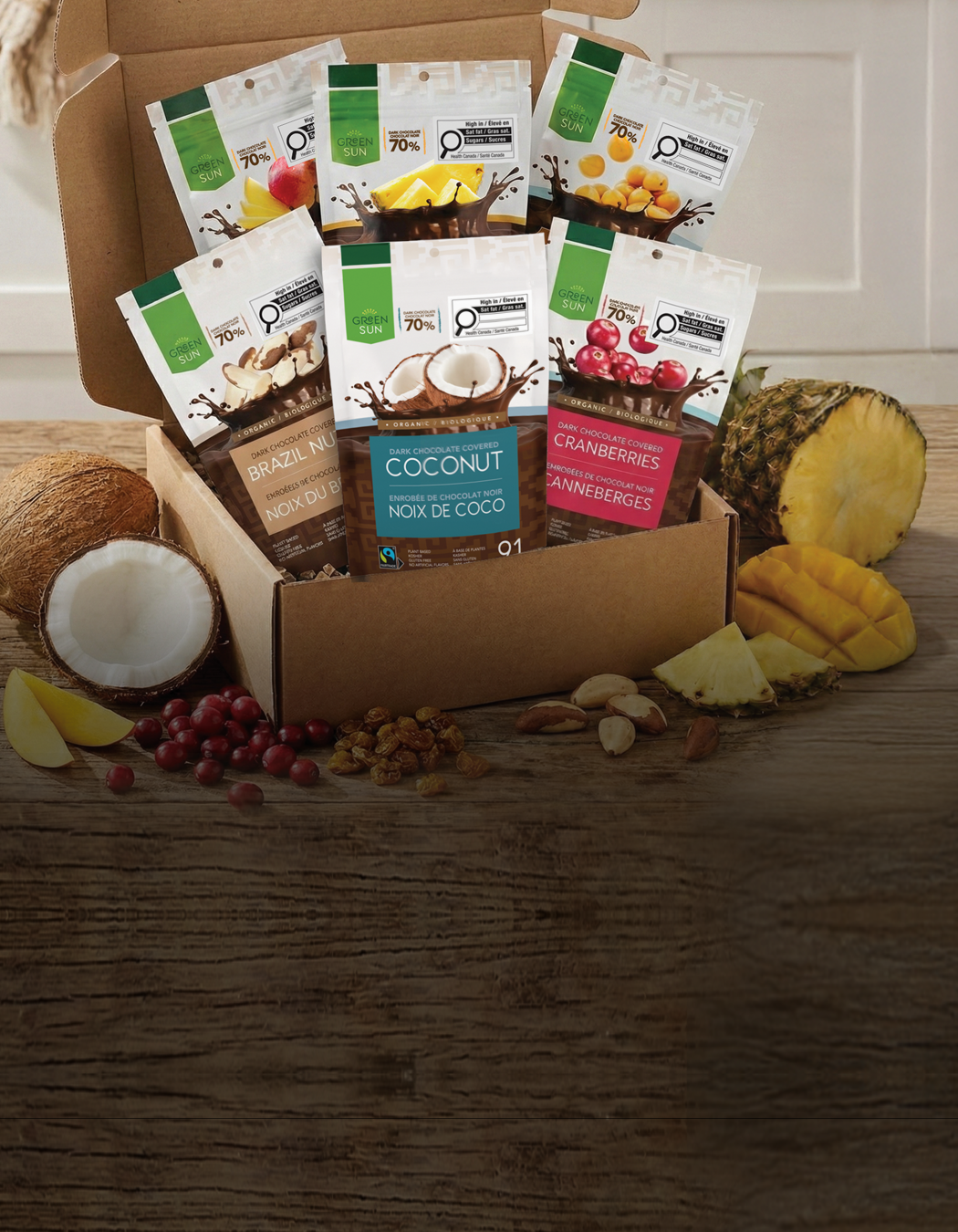 Green Sun Build-a-Box organic dark chocolate fruit snack assortment including mango, pineapple, coconut, cranberries, brazil nuts and goldenberries.
