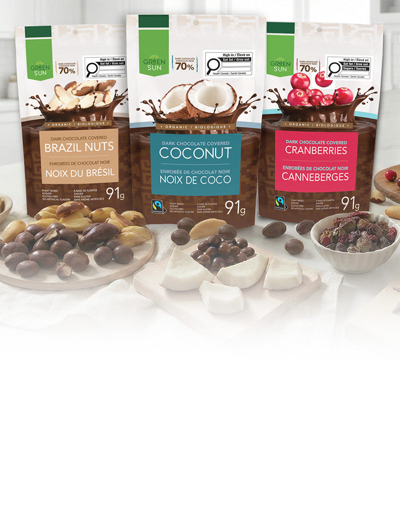Green Sun organic dark chocolate snacks featuring brazil nuts, coconut and cranberries made with 70% Peruvian cacao.