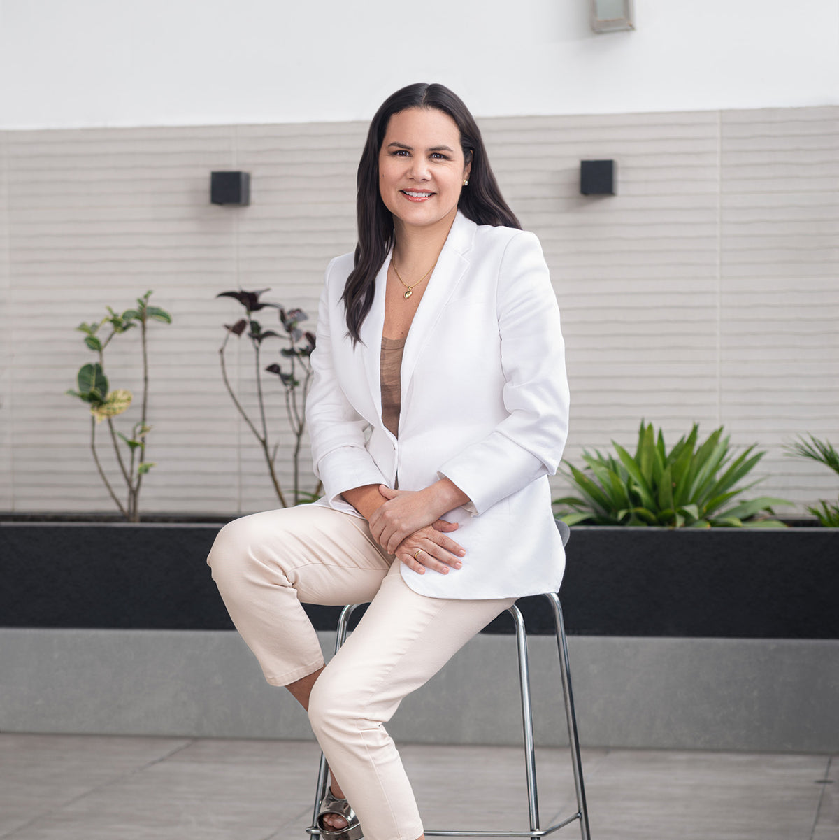 Green Sun founder seated on a stool